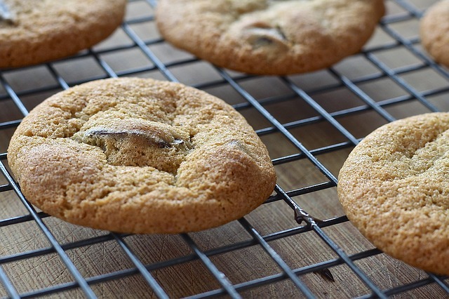 Fresh-baked cookies cooling on a wire rack